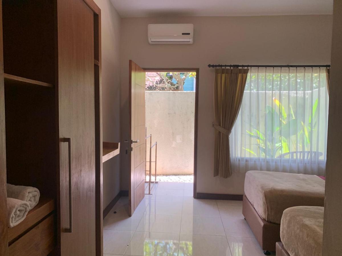 Kuta Suci Guesthouse Экстерьер фото